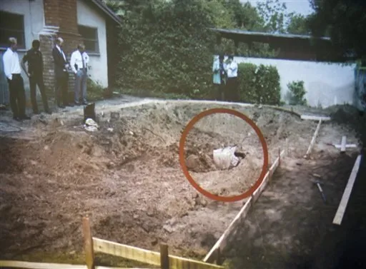 A photo of swimming pool area being unearthed 1994 and finding the remains of John Sohus in the backyard of a home on Loraine Road.